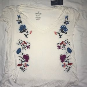 White embroidered American Eagle T-shirt.